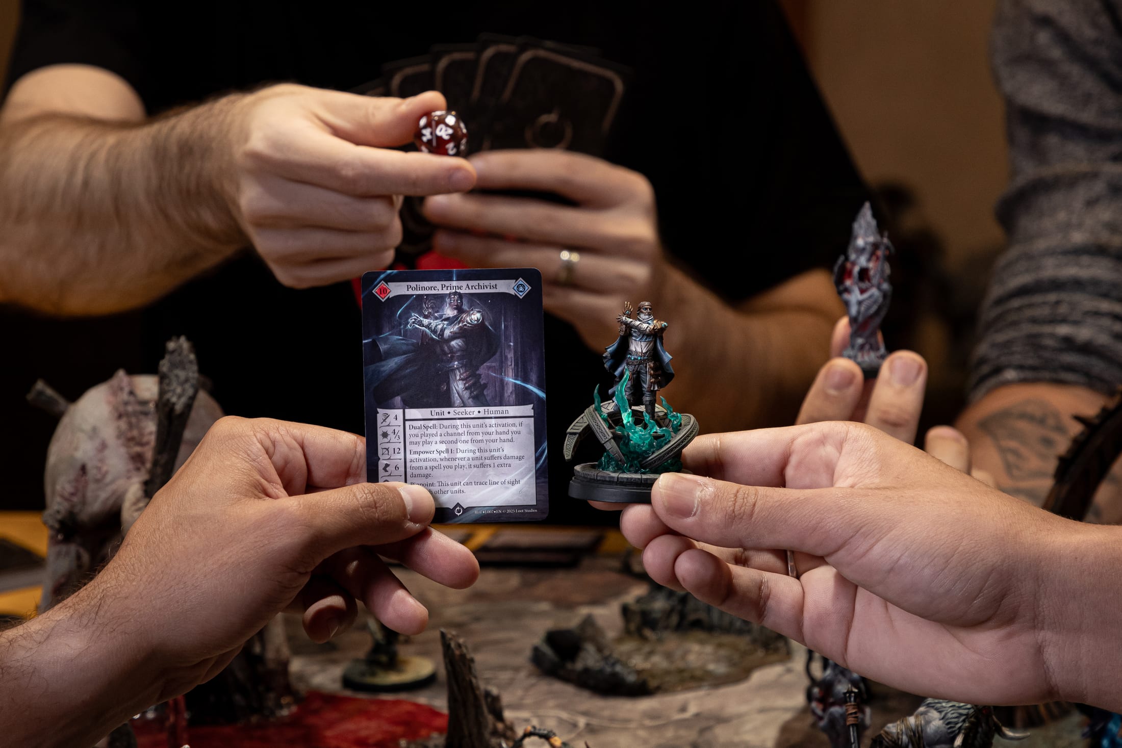 Malediction card and miniature in play